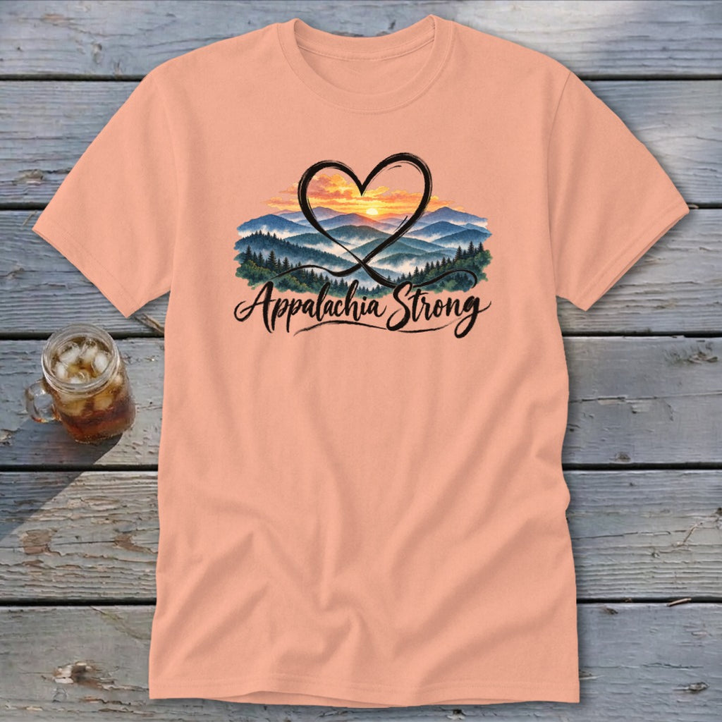 Peach t-shirt with a heart over a mountain sunset and "Appalachia Strong" text.