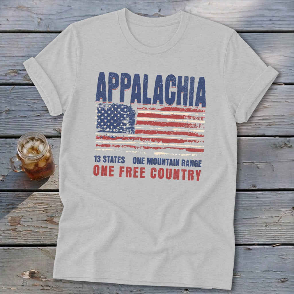 Light gray crewneck t-shirt featuring a distressed American flag graphic with the text Appalachia, 13 states, and one free country.