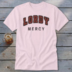 Pink t-shirt with "LORDY MERCY" text in distressed red and black font.