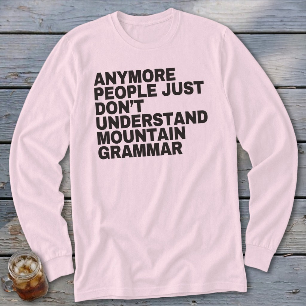 Pink long sleeve shirt with black text that reads "Anymore people just don't understand mountain grammar."