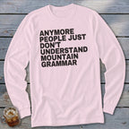 Pink long sleeve shirt with black text that reads "Anymore people just don't understand mountain grammar."