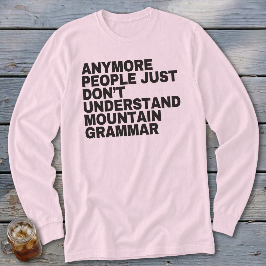 Pink long sleeve shirt with black text that reads "Anymore people just don't understand mountain grammar."