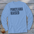 Light blue long-sleeve shirt with "PENNSYLVANIA RAISED" text.