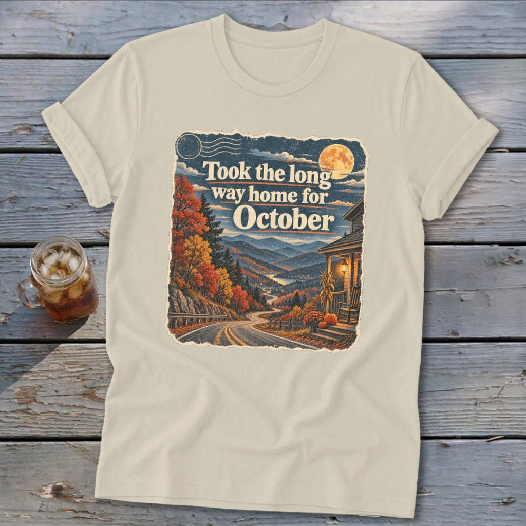 Cream t-shirt with "Took the long way home for October" text over autumn mountain scene.
