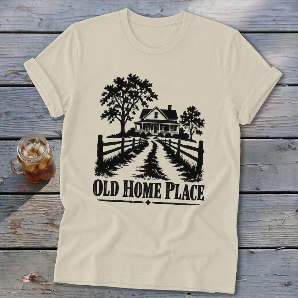 T-shirt with black graphic of a farmhouse, trees, and fence, saying "OLD HOME PLACE".