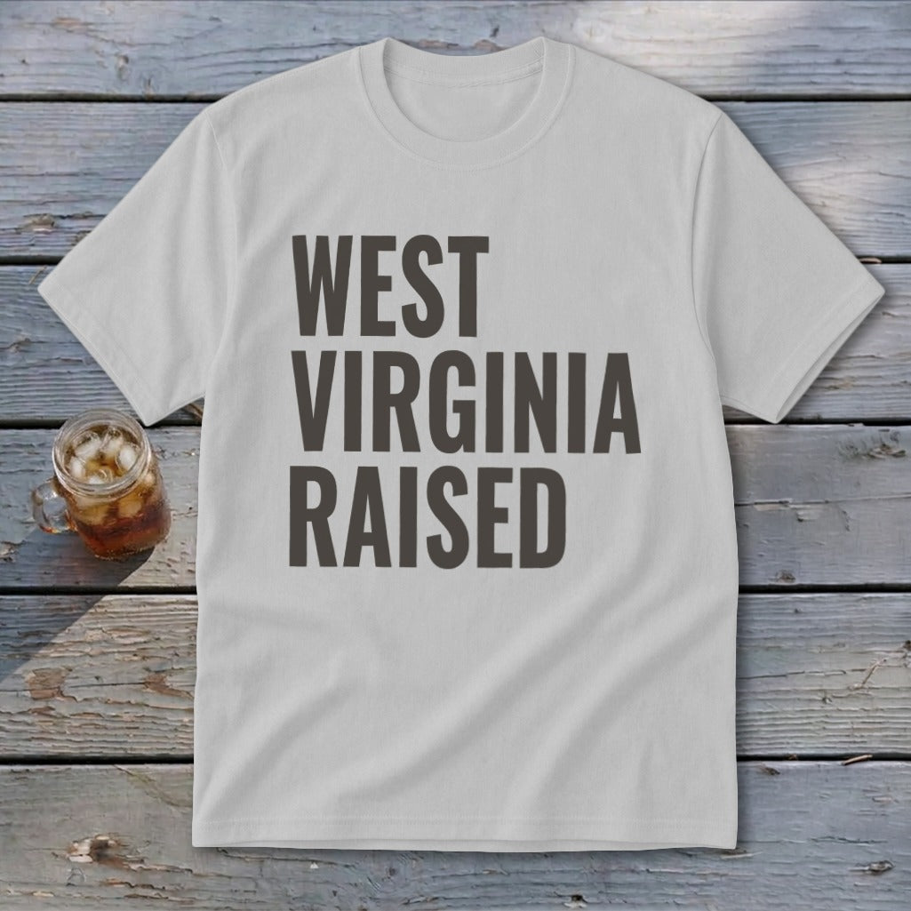 White t-shirt with "WEST VIRGINIA RAISED" printed in dark gray block letters.