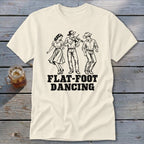 T-shirt with black illustration of people flat-foot dancing to a fiddle player.