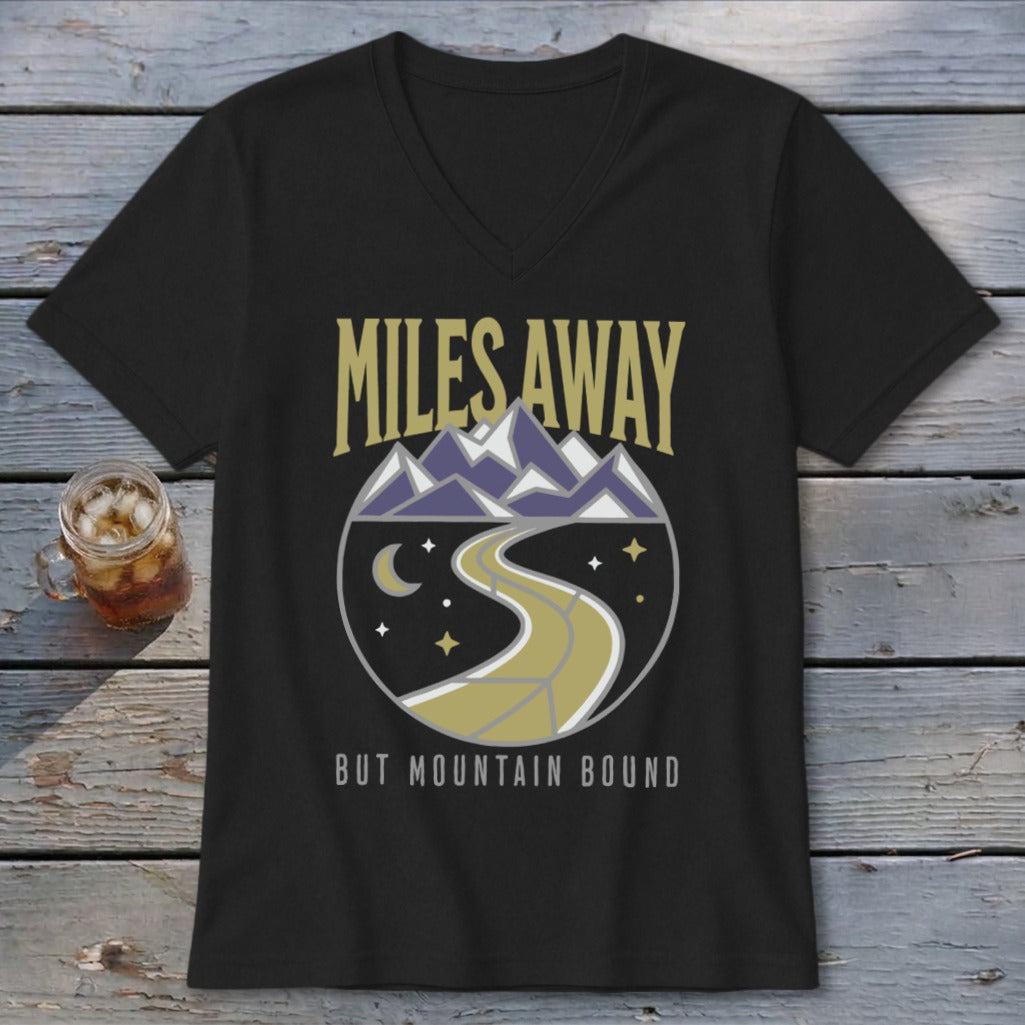 Black t-shirt with "Miles Away But Mountain Bound" text and mountain landscape graphic.