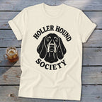 Cream t-shirt with black "Holler Hound Society" text and dog graphic.