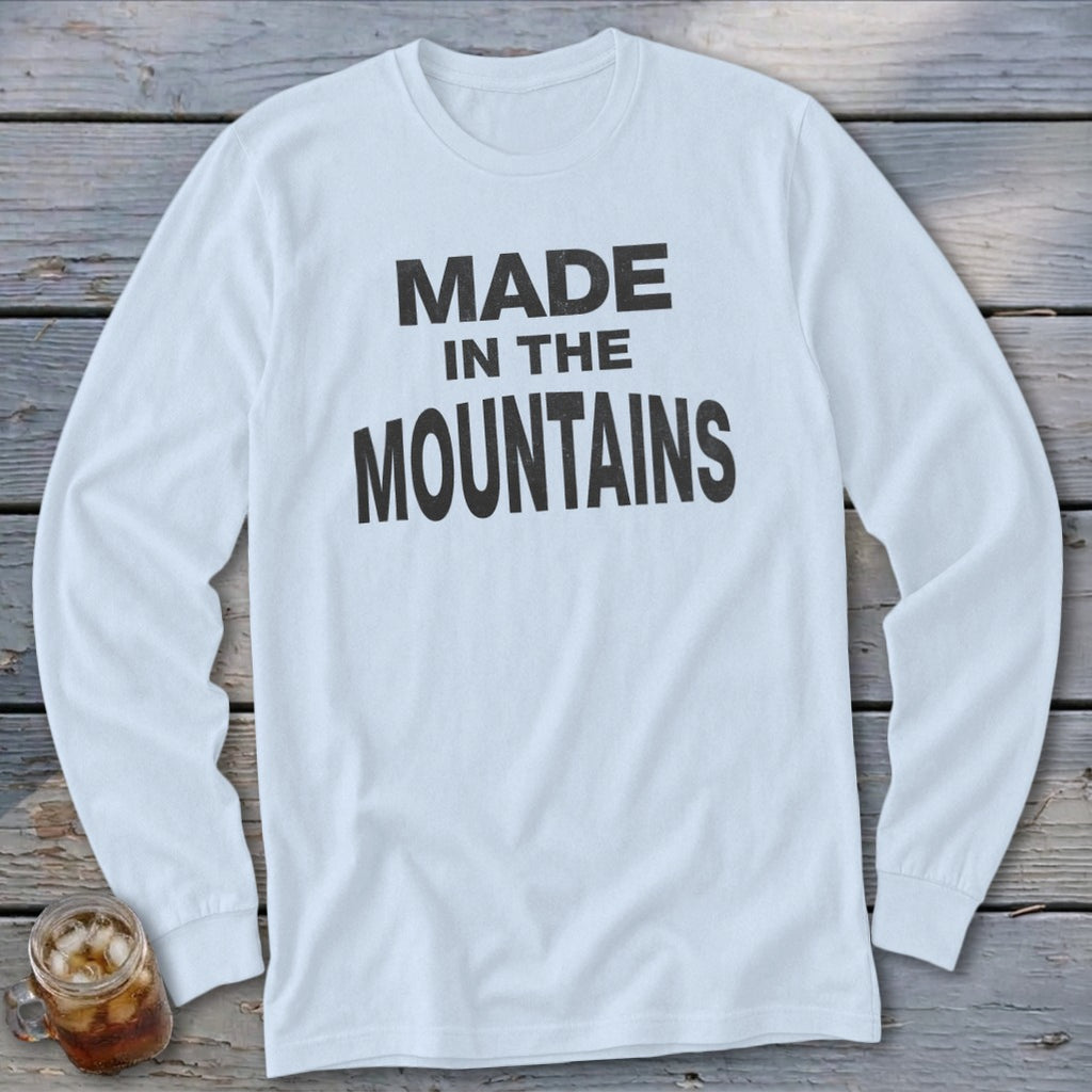White long-sleeve shirt with "MADE IN THE MOUNTAINS" text.