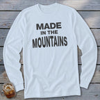 White long-sleeve shirt with "MADE IN THE MOUNTAINS" text.