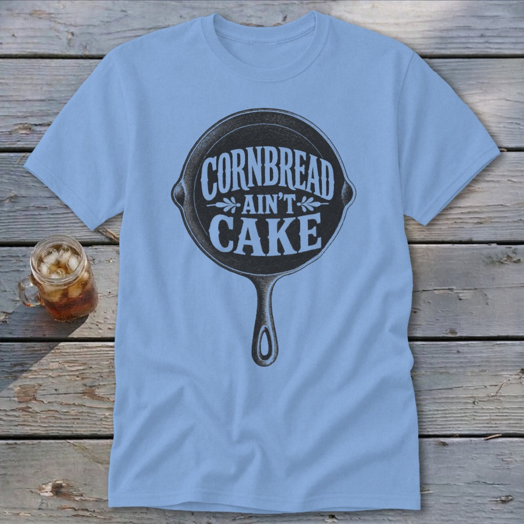 Light blue t-shirt with a cast iron skillet graphic and "Cornbread Ain't Cake" text.