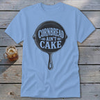 Light blue t-shirt with a cast iron skillet graphic and "Cornbread Ain't Cake" text.