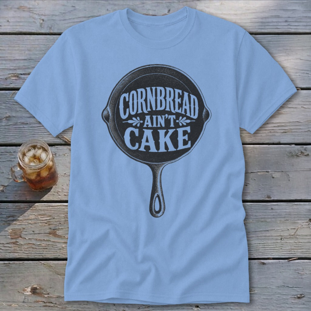 Light blue t-shirt with a cast iron skillet graphic and "Cornbread Ain't Cake" text.