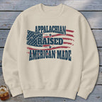 Cream sweatshirt with distressed American flag and text: Appalachian Raised American Made.