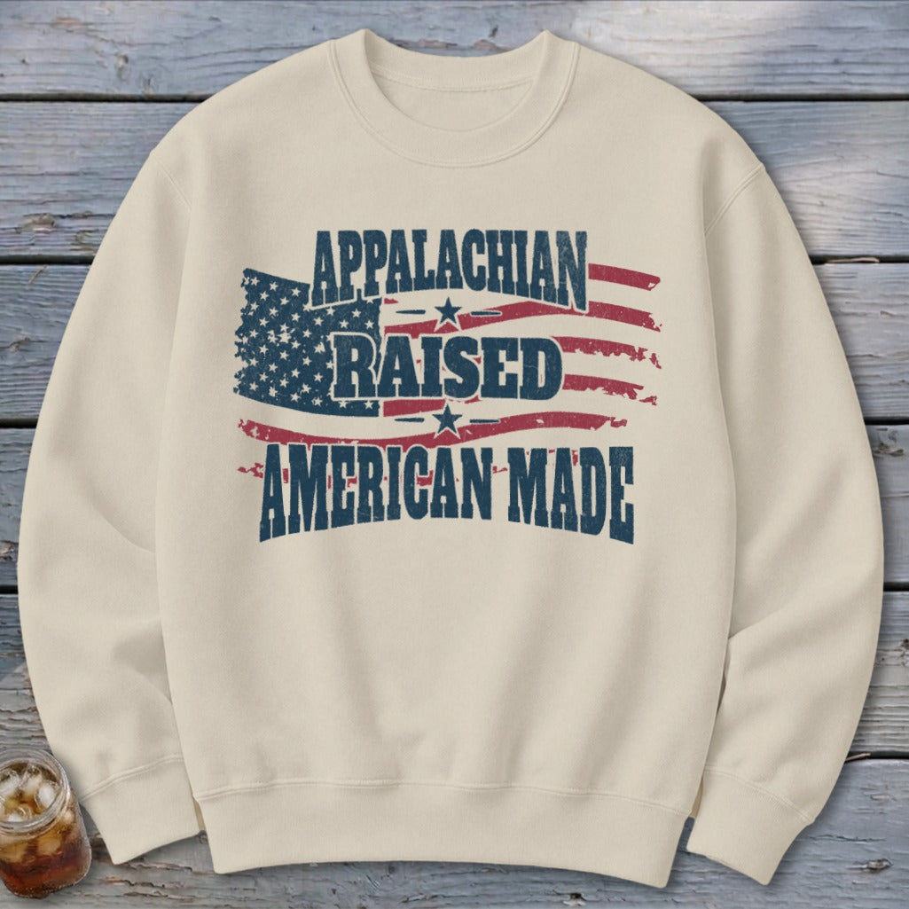 Cream sweatshirt with distressed American flag and text: Appalachian Raised American Made.