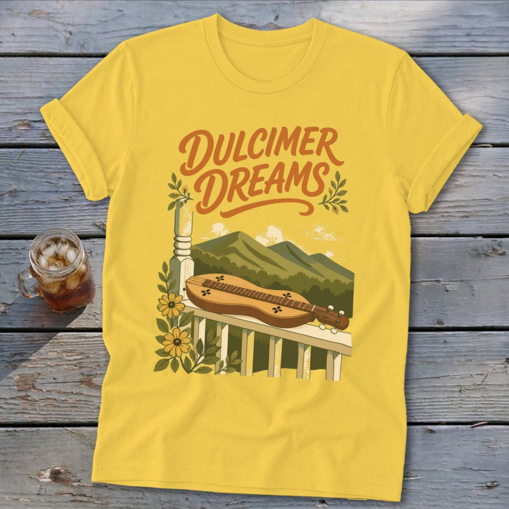 Yellow t-shirt with "Dulcimer Dreams" text, dulcimer, mountains, and flowers graphic.