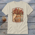 Sorghum text on a barrel overflowing with sorghum stalks, on a tan t-shirt.