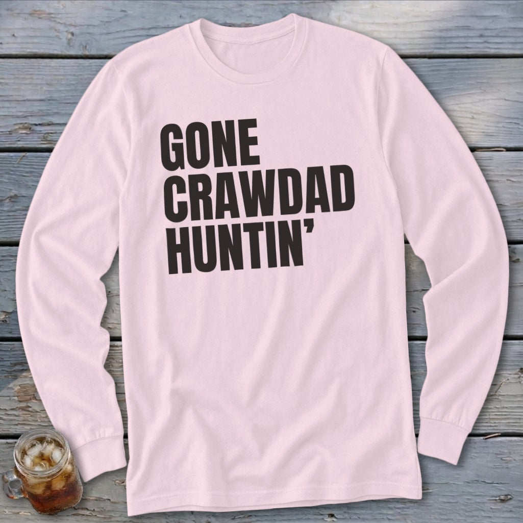 Pink long-sleeve shirt with black text that reads "GONE CRAWDAD HUNTIN'".