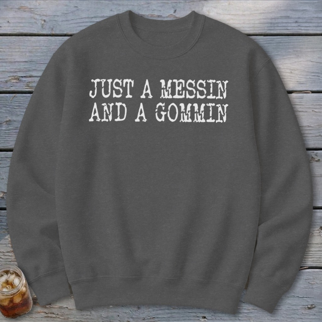 Charcoal sweatshirt with white text "JUST A MESSIN AND A GOMMIN".