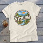 Cream t-shirt with a circular graphic of mountains, a river, trees, and the word "Virginia".