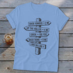 A light blue t-shirt with a graphic of wooden directional signs pointing to various locations.