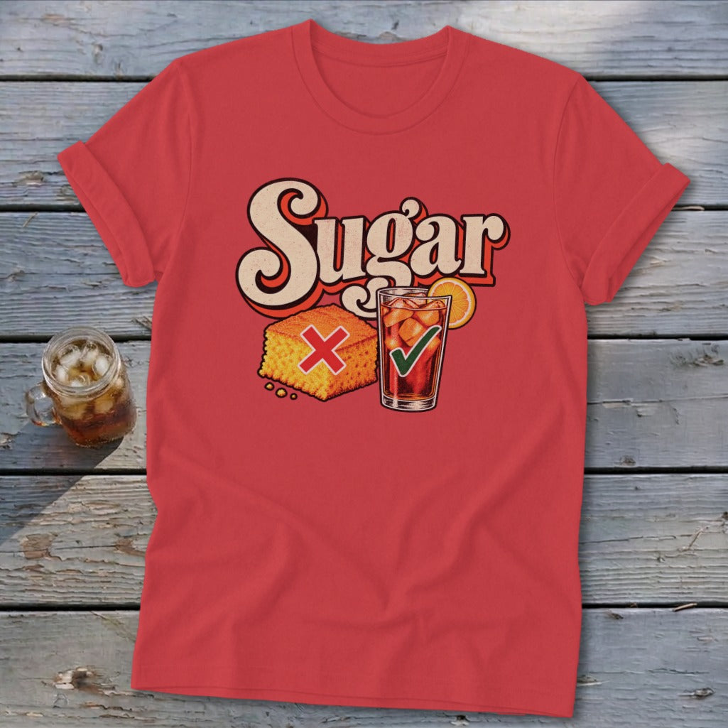 Red t-shirt featuring a retro graphic of cornbread with a red X and iced tea with a green checkmark under the word Sugar.