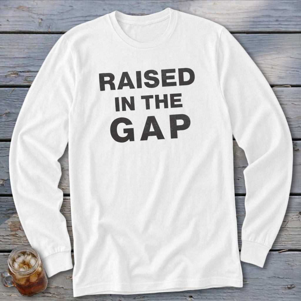 White long-sleeve shirt with black text "RAISED IN THE GAP".