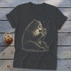 Bear sitting and holding a jar filled with stars and fireflies.