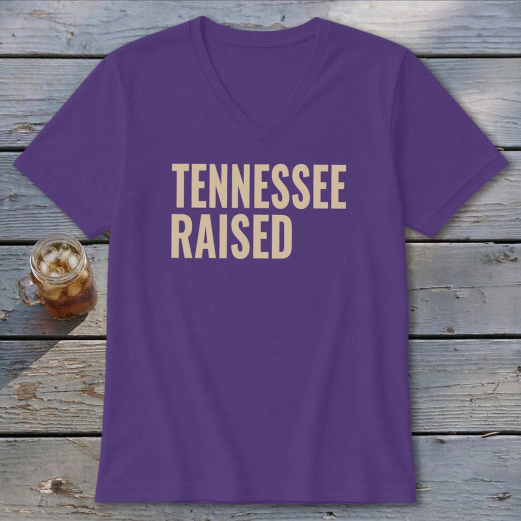 Purple v-neck t-shirt with "TENNESSEE RAISED" text in beige.