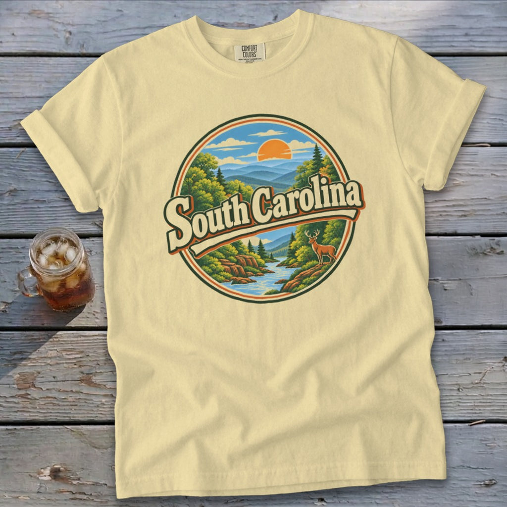 Light yellow t-shirt with a circular graphic of a South Carolina landscape and deer.