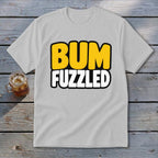 A light gray t-shirt with the word BUM in yellow and FUZZLED in white on the front.