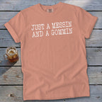 Peach t-shirt with white text "JUST A MESSIN AND A GOMMIN".