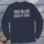 Navy long-sleeve shirt with white and peach text reading "THESE HOLLERS KNOW MY NAME."