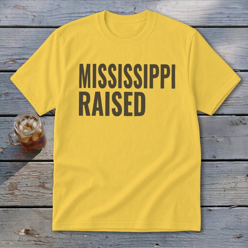 Yellow t-shirt with "MISSISSIPPI RAISED" printed in dark gray text.