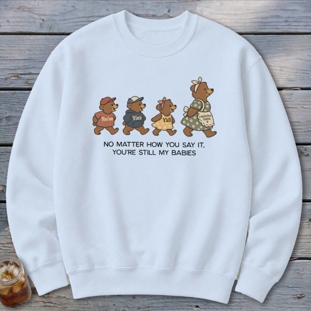 Light blue sweatshirt with graphic of four bears and text "No Matter How You Say It, You're Still My Babies".