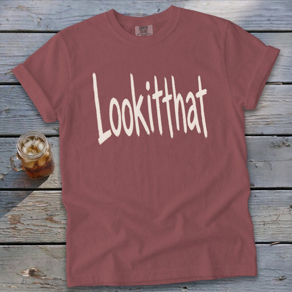 Dusty rose t-shirt with "Lookitthat" in distressed white lettering.