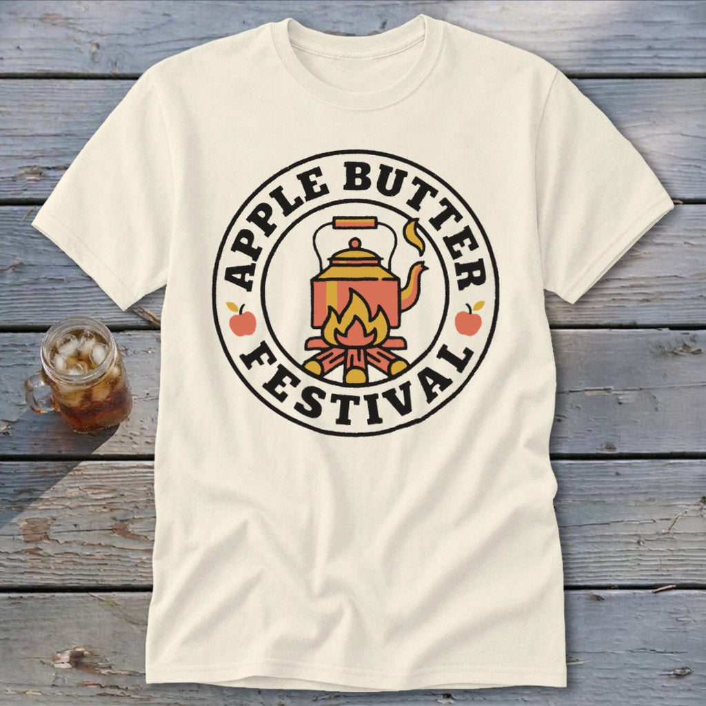 Cream t-shirt with circular graphic: "Apple Butter Festival" surrounding a teapot over a campfire.