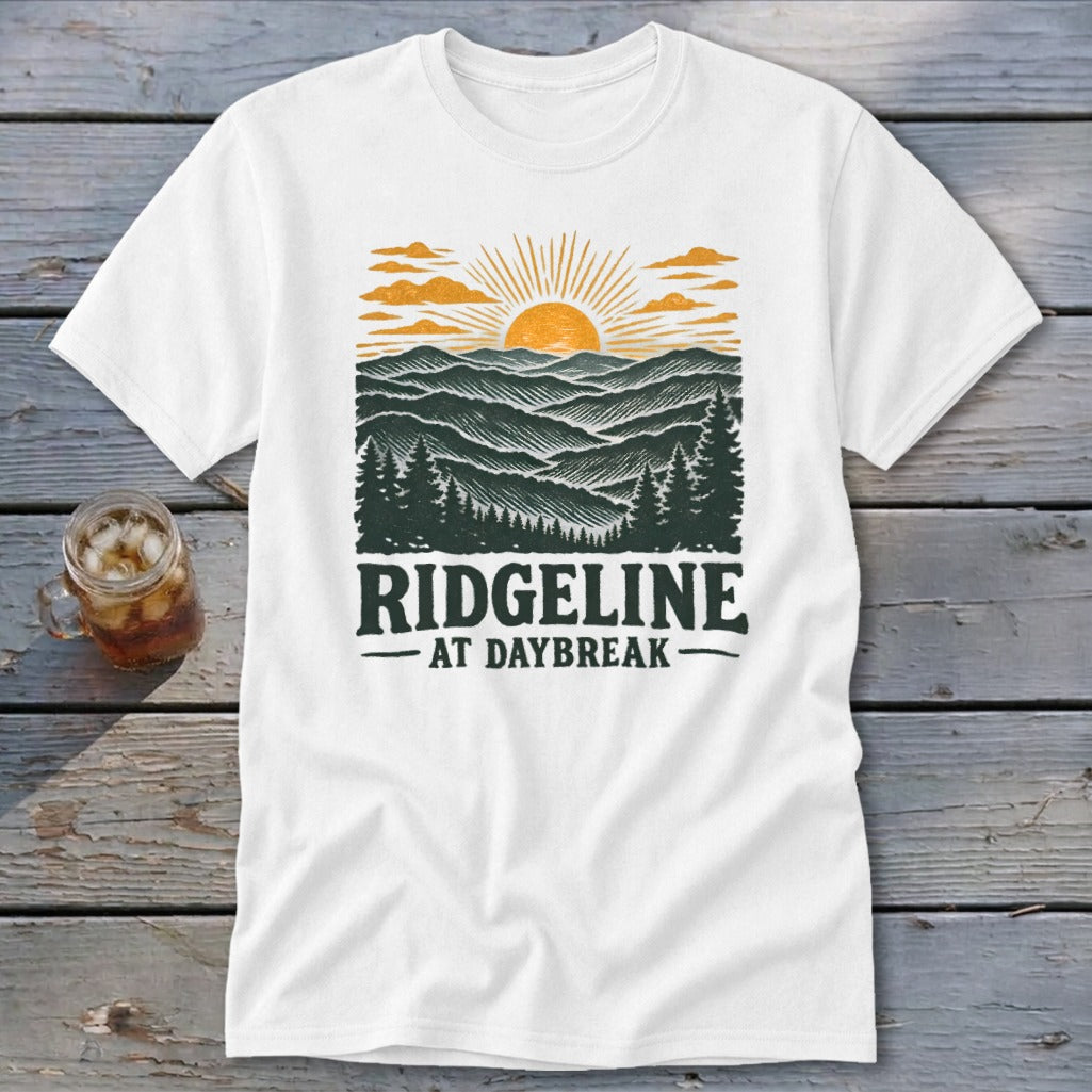 White t-shirt with "RIDGELINE AT DAYBREAK" text and mountain sunrise graphic.