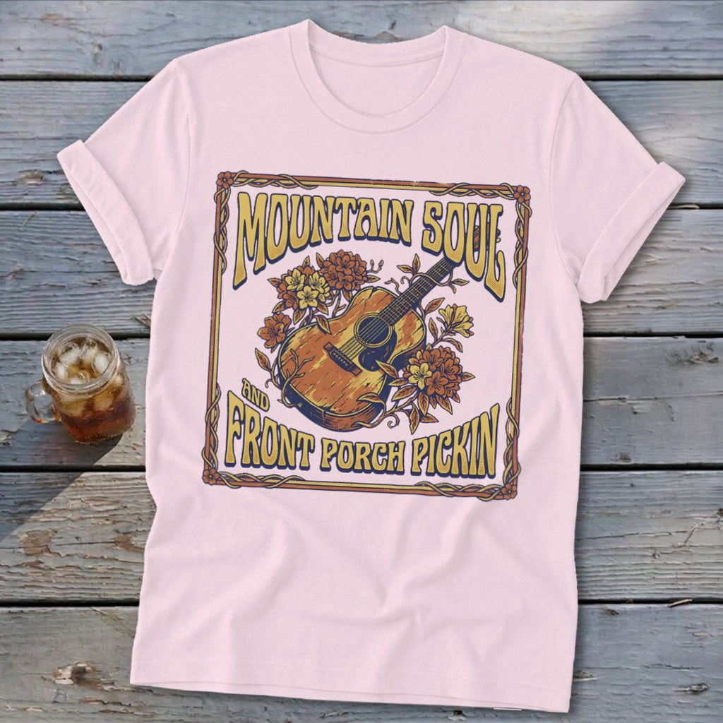 Light pink t-shirt with "Mountain Soul and Front Porch Pickin'" text and guitar art.
