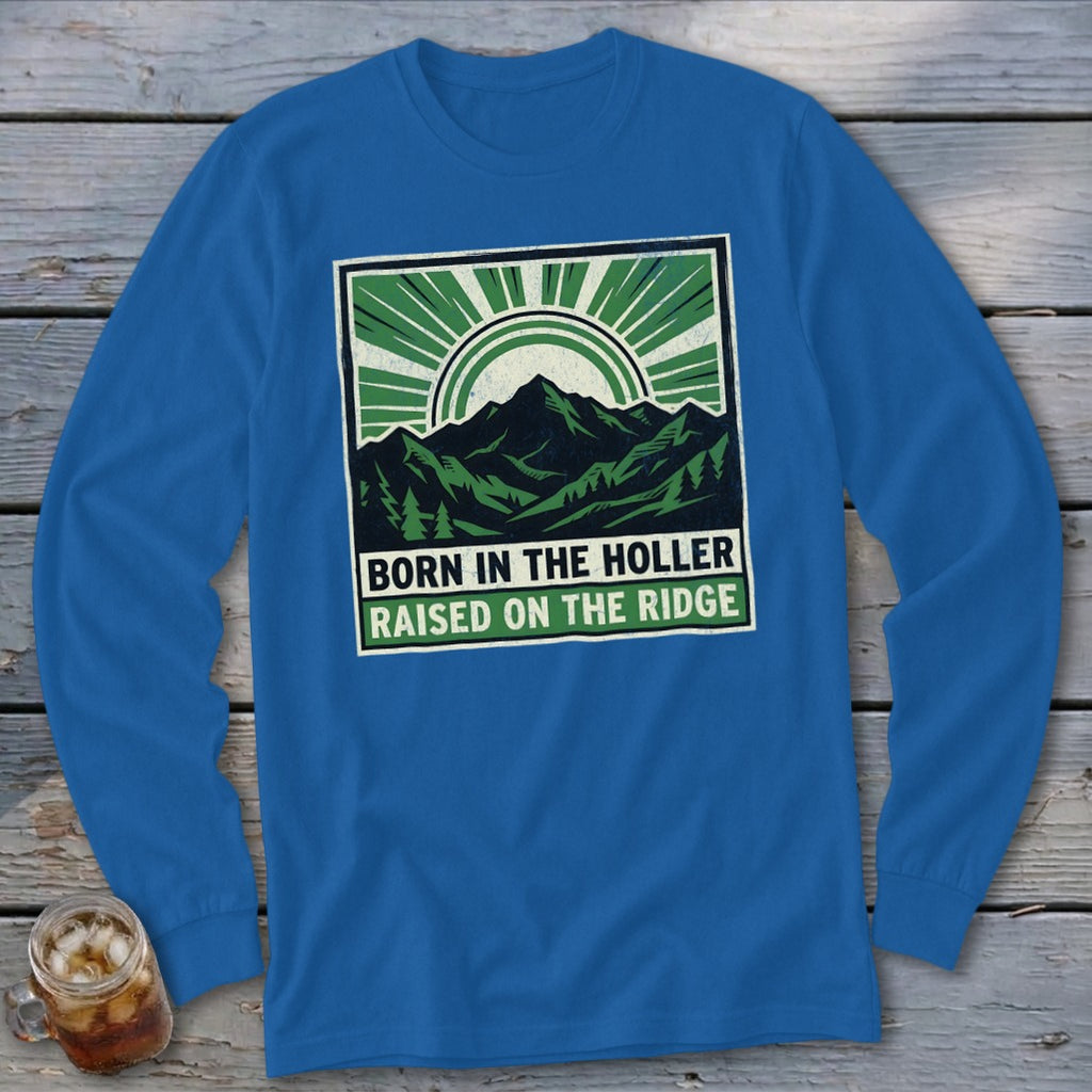 Royal blue long-sleeve t-shirt with a green and white mountain graphic and text reading BORN IN THE HOLLER RAISED ON THE RIDGE.