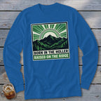 Royal blue long-sleeve t-shirt with a green and white mountain graphic and text reading BORN IN THE HOLLER RAISED ON THE RIDGE.