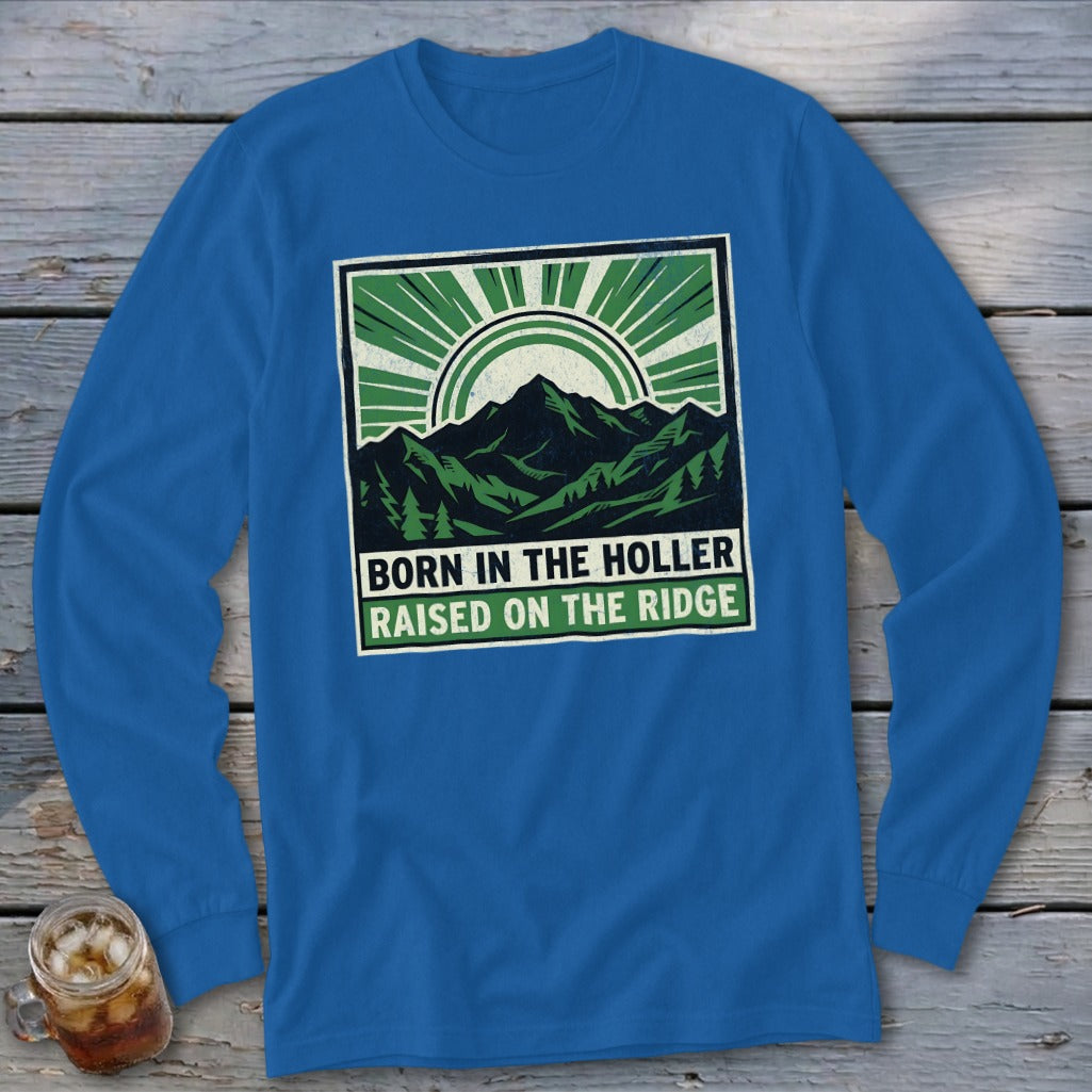 Royal blue long-sleeve t-shirt with a green and white mountain graphic and text reading BORN IN THE HOLLER RAISED ON THE RIDGE.