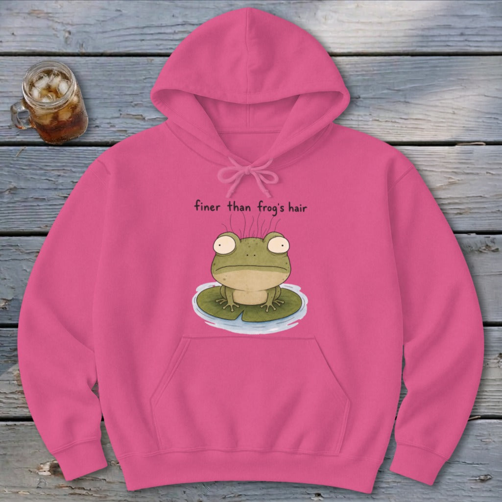 A pink hooded sweatshirt featuring an illustration of a green frog on a lily pad with the text finer than frog's hair.