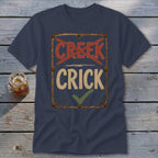 Navy t-shirt with distressed sign: "CREEK" crossed out, "CRICK" checked off.