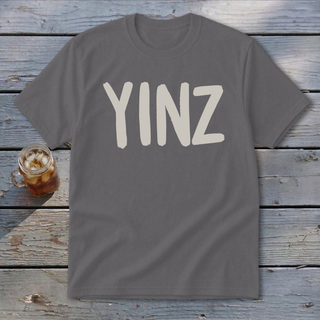 Gray t-shirt with "YINZ" text in a tan, brushstroke font.
