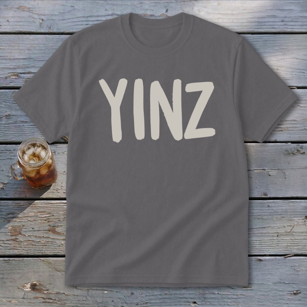 Gray t-shirt with "YINZ" text in a tan, brushstroke font.