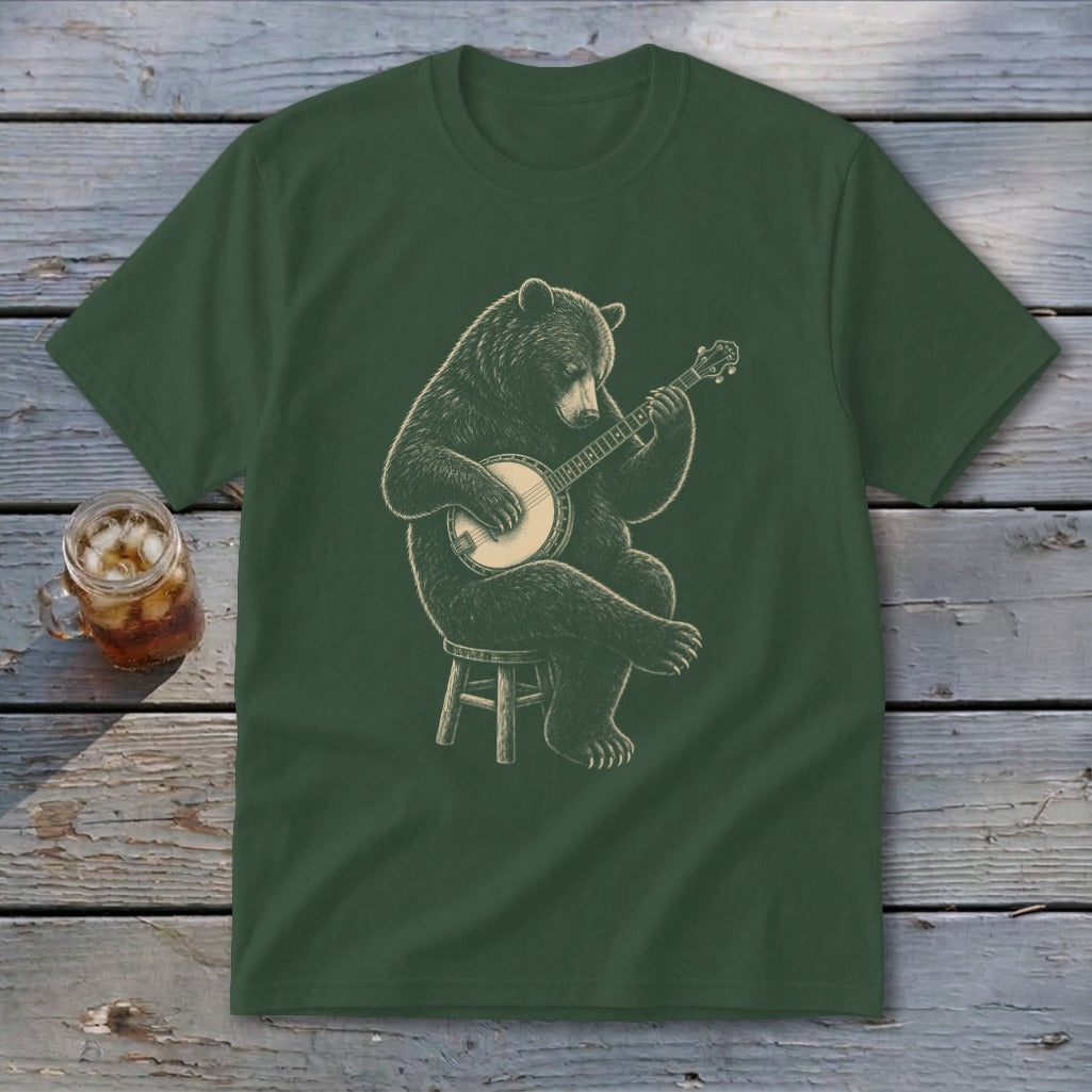 Bear sitting on stool playing banjo graphic on dark green t-shirt.