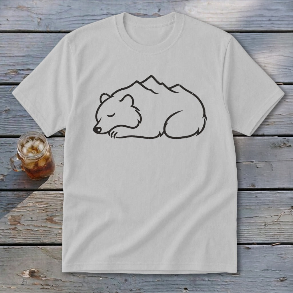 White t-shirt with a black outline drawing of a sleeping bear with mountains on its back.