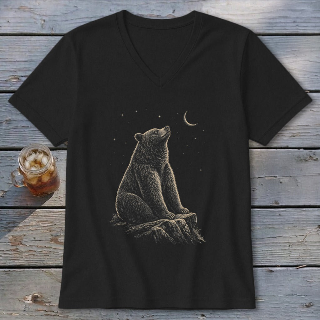 Black t-shirt with a bear sitting on a rock, looking at the moon and stars.